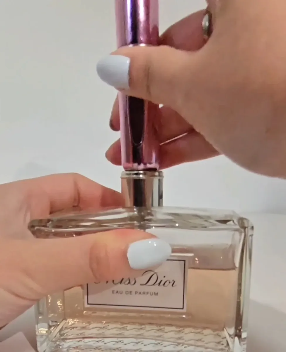 Refillable atomizer showing the pump mechanism