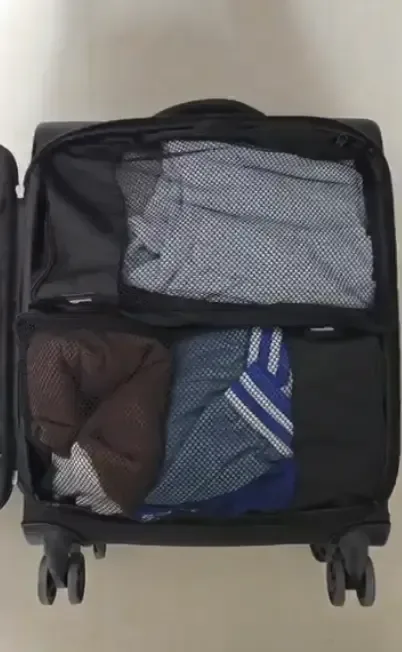 Packing cubes organized inside an open suitcase