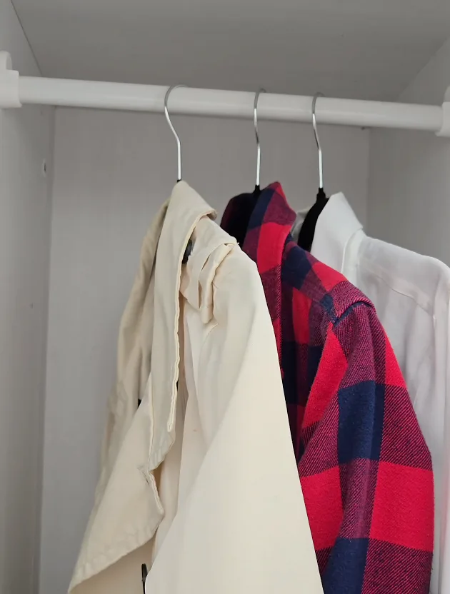 Velvet hangers holding a dress shirt without slipping
